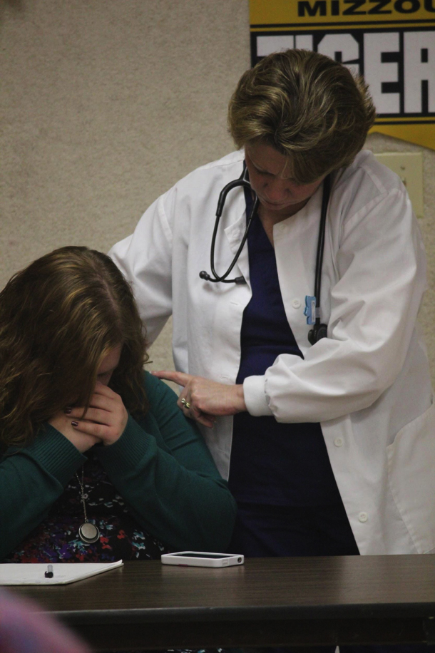 Here, a nurse consoles the niece of the patient who has just been diagnosed with breast cancer in an overtly blunt manner.  The doctor’s goal was to make sure the patient took his treatment instructions seriously, but his means of pursuing the goal lacked sensitivity.